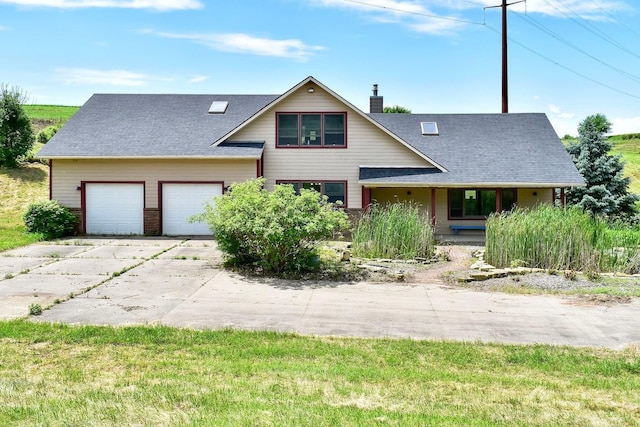 S3093 Baertsch Valley Rd, Cross Twp, WI 54629 - view of front of property with driveway, a chimney, an attached garage, and a shingled roof
