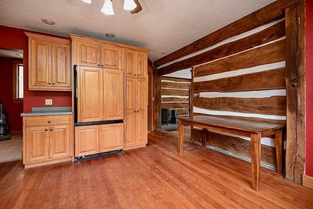 S3093 Baertsch Valley Rd, Cross Twp, WI 54629 - kitchen featuring paneled built in refrigerator, wood-type flooring, and a textured ceiling