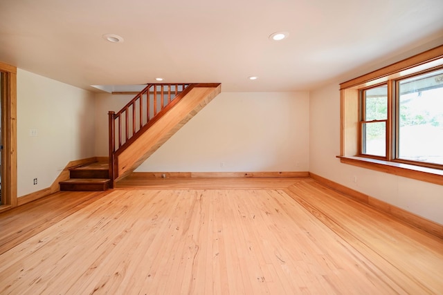 S3093 Baertsch Valley Rd, Cross Twp, WI 54629 - spare room with stairs, hardwood / wood-style floors, and recessed lighting