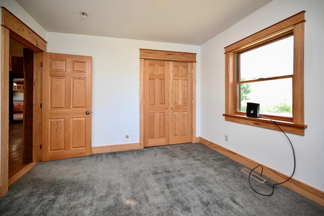 S3093 Baertsch Valley Rd, Cross Twp, WI 54629 - unfurnished bedroom with carpet floors and a closet