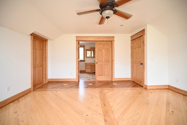 S3093 Baertsch Valley Rd, Cross Twp, WI 54629 - unfurnished room featuring light wood-style flooring, a ceiling fan, and vaulted ceiling