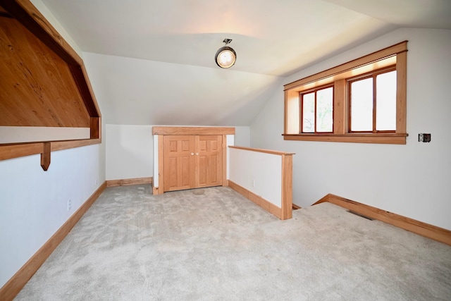 S3093 Baertsch Valley Rd, Cross Twp, WI 54629 - additional living space featuring lofted ceiling and light carpet