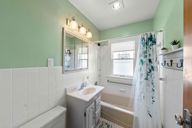 4334 Thomas Ave N, Minneapolis, MN 55412 - bathroom with vanity, shower / bath combo with shower curtain, and tile walls