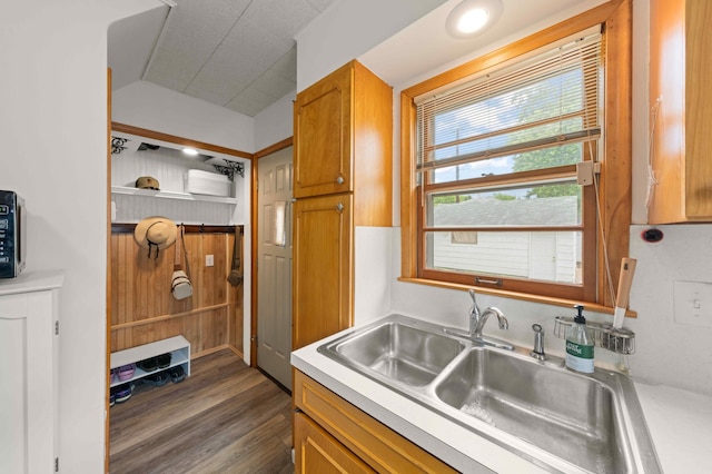 4334 Thomas Ave N, Minneapolis, MN 55412 - kitchen with light countertops, dark wood-type flooring, and brown cabinets