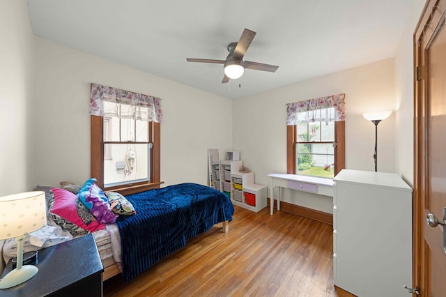 4334 Thomas Ave N, Minneapolis, MN 55412 - bedroom with light wood-style flooring and a ceiling fan