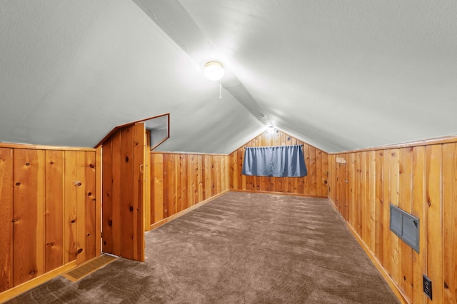 4334 Thomas Ave N, Minneapolis, MN 55412 - additional living space with carpet flooring, lofted ceiling, and wood walls