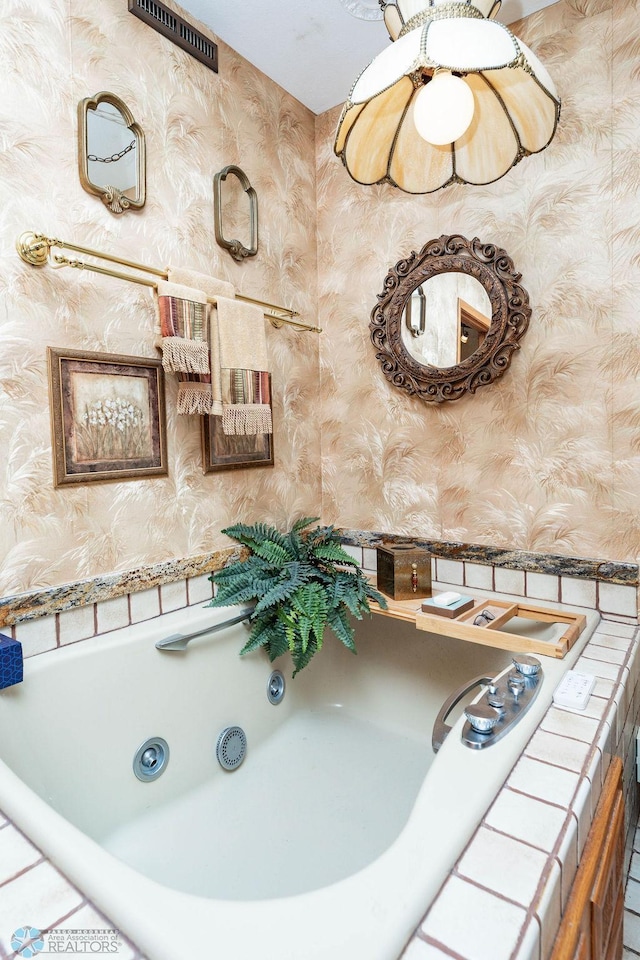 15 Fremont Dr S, Fargo, ND 58103 - bathroom with wallpapered walls and a tub with jets