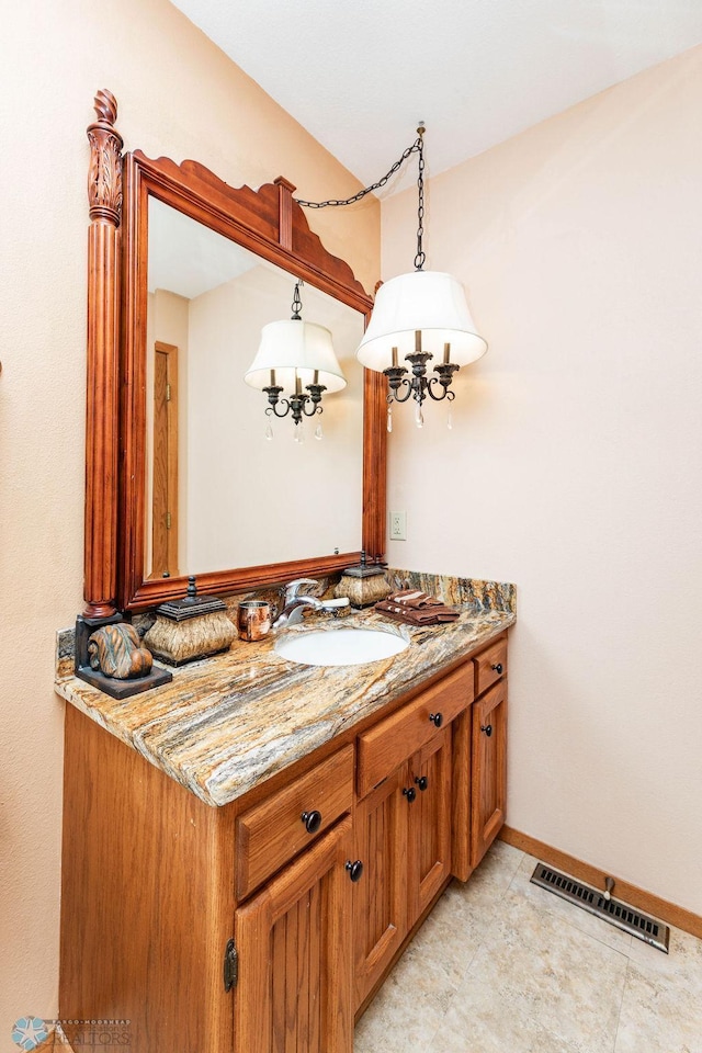 15 Fremont Dr S, Fargo, ND 58103 - bathroom featuring vanity and a chandelier