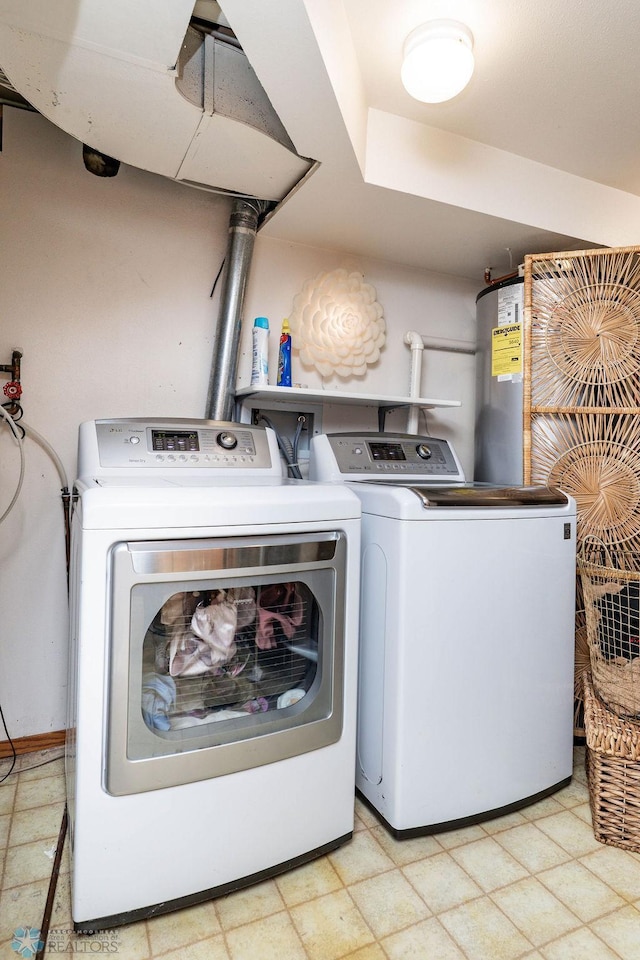 15 Fremont Dr S, Fargo, ND 58103 - washroom with separate washer and dryer, gas water heater, and tile patterned floors