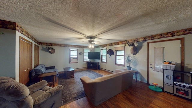 500 Main Ave, Lafayette, MN 56054 - living area with baseboard heating, wood finished floors, a ceiling fan, cooling unit, and a textured ceiling