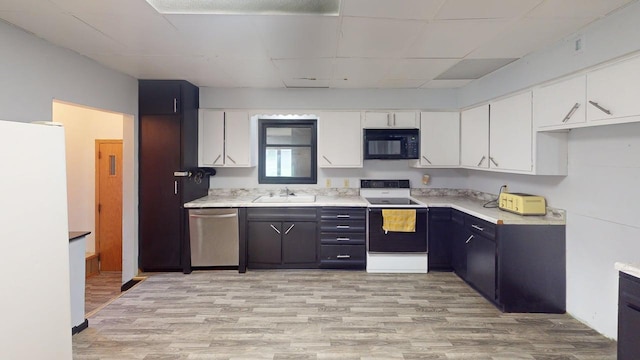 500 Main Ave, Lafayette, MN 56054 - kitchen with white appliances, light countertops, white cabinets, and light wood-type flooring