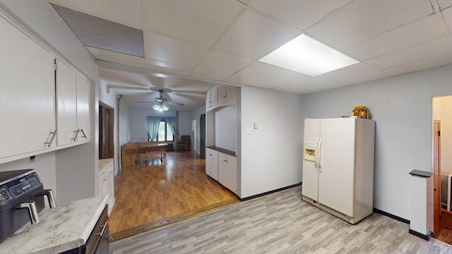500 Main Ave, Lafayette, MN 56054 - kitchen with white fridge with ice dispenser, light wood-type flooring, white cabinetry, a ceiling fan, and a drop ceiling