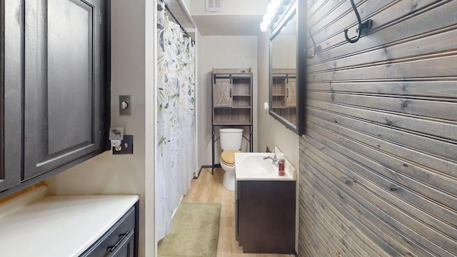 500 Main Ave, Lafayette, MN 56054 - bathroom with vanity, curtained shower, and wooden walls