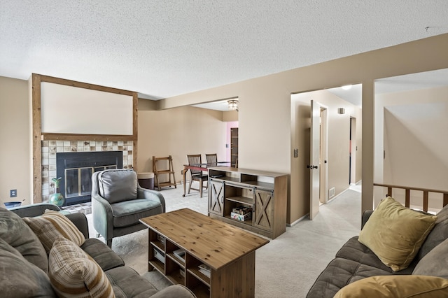 2365 Dorland Ln E, Maplewood, MN 55119 - living room with light carpet, a tile fireplace, and a textured ceiling
