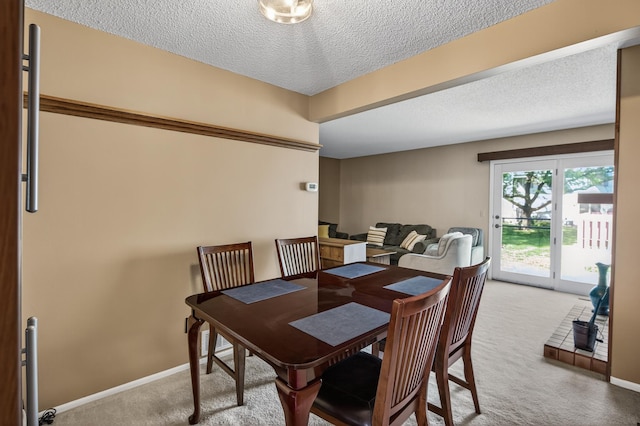 2365 Dorland Ln E, Maplewood, MN 55119 - carpeted dining room featuring a textured ceiling and baseboards