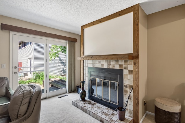 2365 Dorland Ln E, Maplewood, MN 55119 - living room with carpet floors, a fireplace, and a textured ceiling