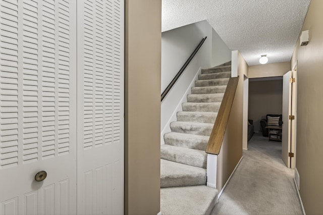 2365 Dorland Ln E, Maplewood, MN 55119 - staircase with a textured ceiling and carpet