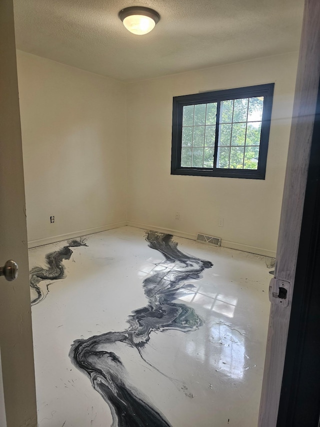 117 Quincy St, Alexandria, MN 56308 - unfurnished room with a textured ceiling