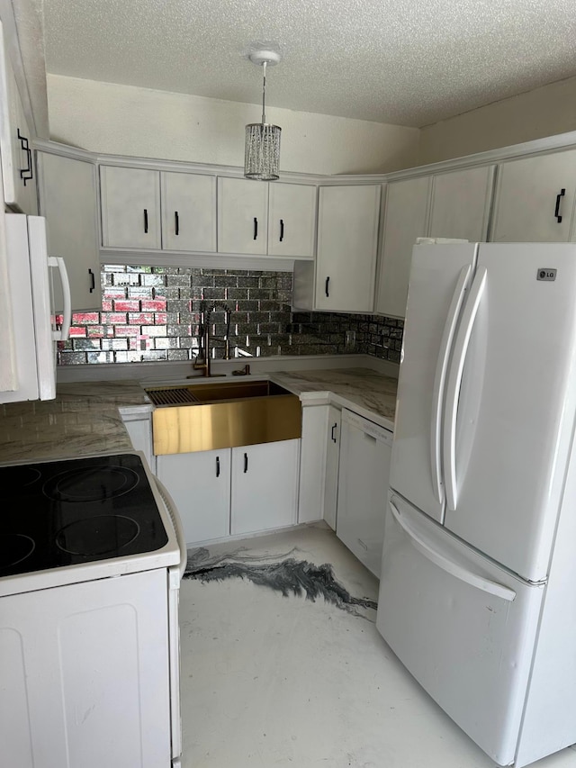 117 Quincy St, Alexandria, MN 56308 - kitchen featuring white appliances, tasteful backsplash, white cabinetry, concrete flooring, and a textured ceiling
