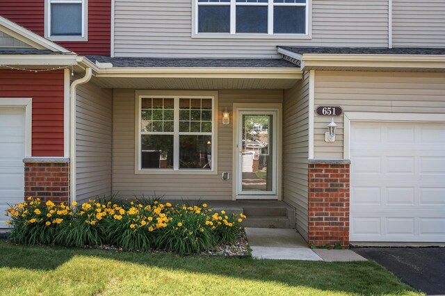 651 Ravencroft Rd, Waconia, MN 55387 - doorway to property with brick siding and a garage
