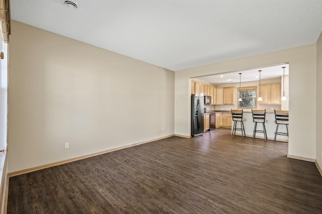 651 Ravencroft Rd, Waconia, MN 55387 - unfurnished living room with dark wood-style floors and recessed lighting