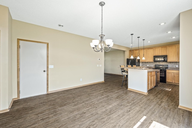 651 Ravencroft Rd, Waconia, MN 55387 - kitchen featuring black appliances, dark wood-style floors, a kitchen breakfast bar, a chandelier, and recessed lighting