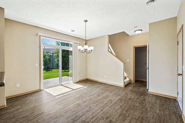 651 Ravencroft Rd, Waconia, MN 55387 - unfurnished room with wood finished floors, stairs, a chandelier, and a textured ceiling
