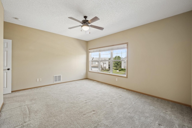 651 Ravencroft Rd, Waconia, MN 55387 - empty room with carpet, ceiling fan, a textured ceiling, and a smoke detector