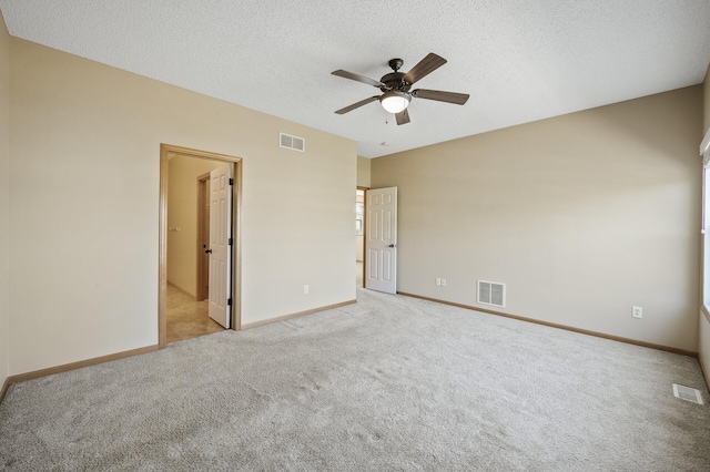 651 Ravencroft Rd, Waconia, MN 55387 - unfurnished bedroom featuring light colored carpet, a textured ceiling, and ceiling fan