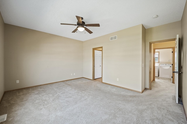 651 Ravencroft Rd, Waconia, MN 55387 - unfurnished bedroom with independent washer and dryer, light colored carpet, and a ceiling fan