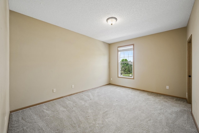 651 Ravencroft Rd, Waconia, MN 55387 - carpeted spare room featuring a textured ceiling and baseboards