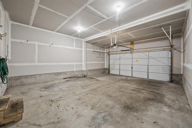 651 Ravencroft Rd, Waconia, MN 55387 - garage featuring a garage door opener