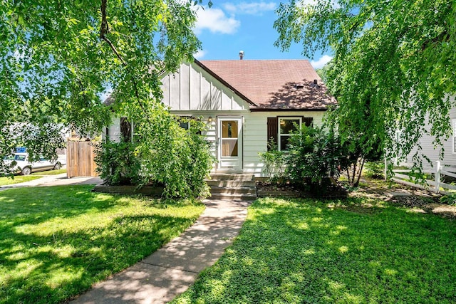5501 30th Ave S, Minneapolis, MN 55417 - view of front facade featuring board and batten siding and roof with shingles