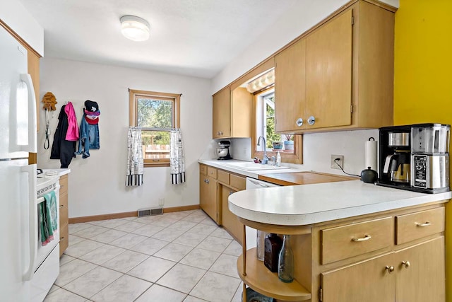 5501 30th Ave S, Minneapolis, MN 55417 - kitchen featuring light countertops, light tile patterned floors, white appliances, open shelves, and a peninsula