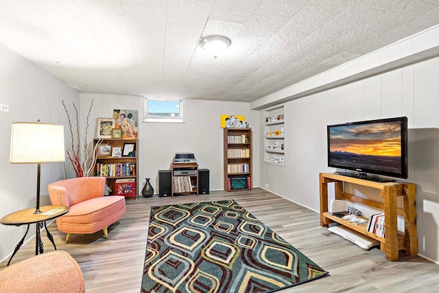 5501 30th Ave S, Minneapolis, MN 55417 - living room featuring wood finished floors, wooden walls, and built in features