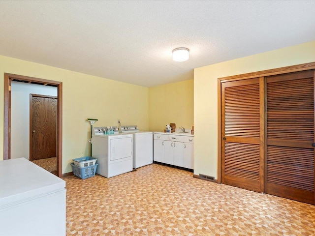 15170 141st Ave, Wadena, MN 56482 - laundry area featuring separate washer and dryer and cabinet space