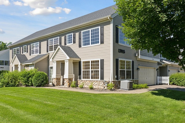 13915 52nd Ave N Unit 1204, Plymouth, MN 55446 - view of front of house featuring a front yard, stone siding, and a garage