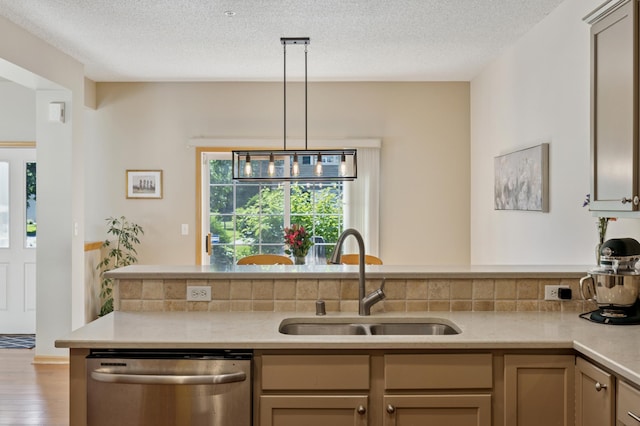 13915 52nd Ave N Unit 1204, Plymouth, MN 55446 - kitchen featuring dishwasher, light countertops, pendant lighting, wood finished floors, and a textured ceiling