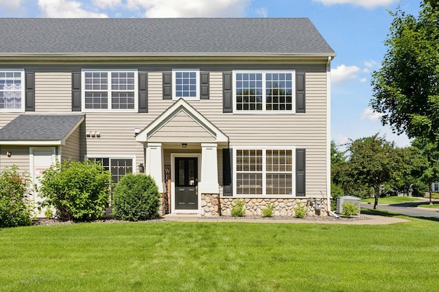 13915 52nd Ave N Unit 1204, Plymouth, MN 55446 - view of front facade featuring a front lawn and stone siding