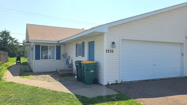 2236 Sacia Ln, Hudson, WI 54016 - view of side of property featuring a garage and roof with shingles