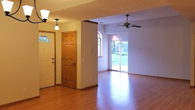 2236 Sacia Ln, Hudson, WI 54016 - entryway featuring light wood-type flooring, ceiling fan, and a chandelier
