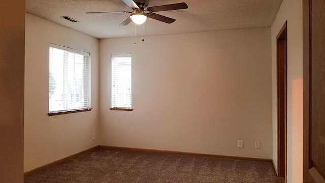 2236 Sacia Ln, Hudson, WI 54016 - empty room featuring dark carpet, ceiling fan, and a textured ceiling