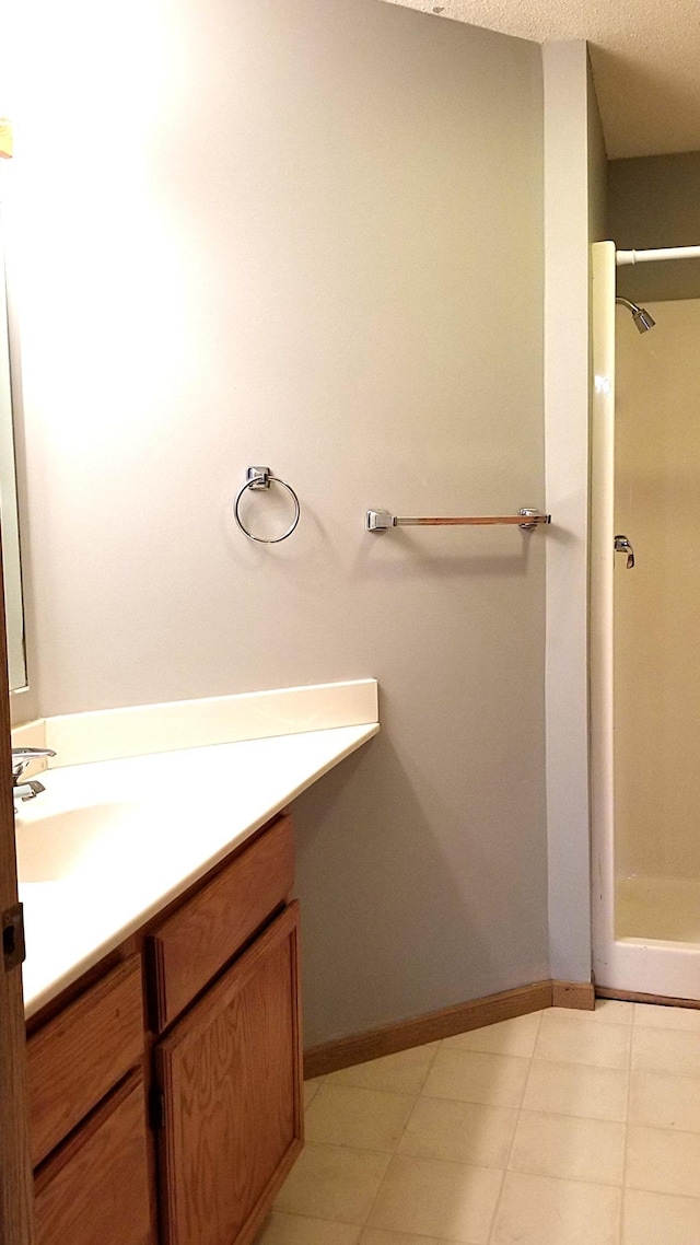 2236 Sacia Ln, Hudson, WI 54016 - full bath featuring vanity, a stall shower, and tile patterned flooring