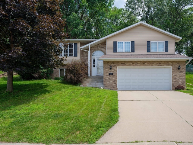 1618 Teton Ct NE, Rochester, MN 55906 - view of front facade featuring an attached garage, brick siding, driveway, and a front lawn