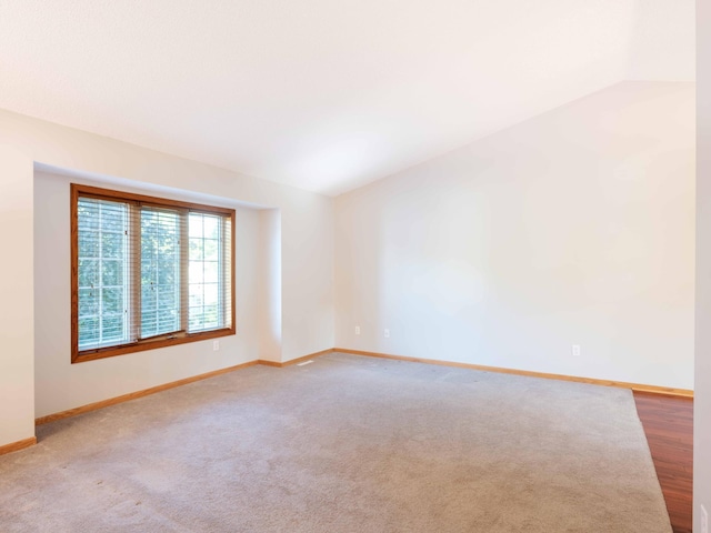 1618 Teton Ct NE, Rochester, MN 55906 - carpeted empty room with vaulted ceiling