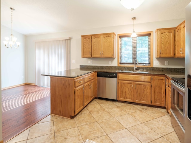 1618 Teton Ct NE, Rochester, MN 55906 - kitchen featuring stainless steel appliances, a peninsula, a chandelier, pendant lighting, and light tile patterned floors