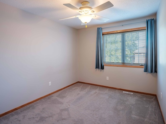 1618 Teton Ct NE, Rochester, MN 55906 - spare room with carpet, a ceiling fan, and a textured ceiling
