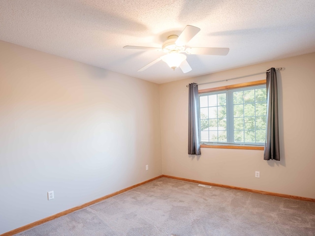 1618 Teton Ct NE, Rochester, MN 55906 - unfurnished room with light carpet, a ceiling fan, and a textured ceiling