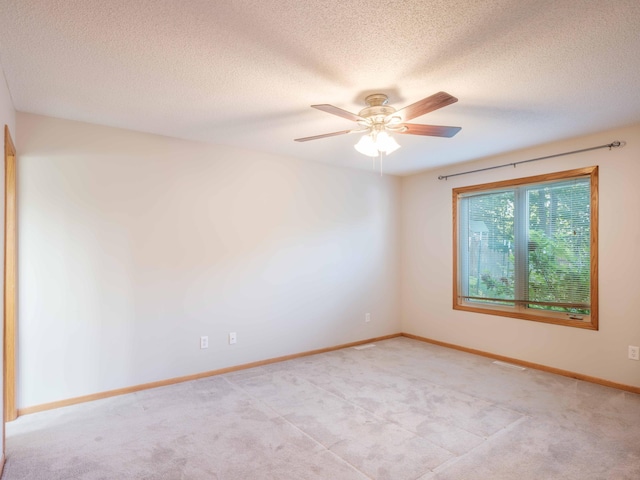 1618 Teton Ct NE, Rochester, MN 55906 - spare room with light carpet, a textured ceiling, and a ceiling fan