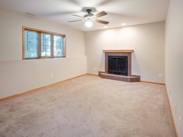 1618 Teton Ct NE, Rochester, MN 55906 - unfurnished living room with a tiled fireplace, carpet flooring, a ceiling fan, and recessed lighting